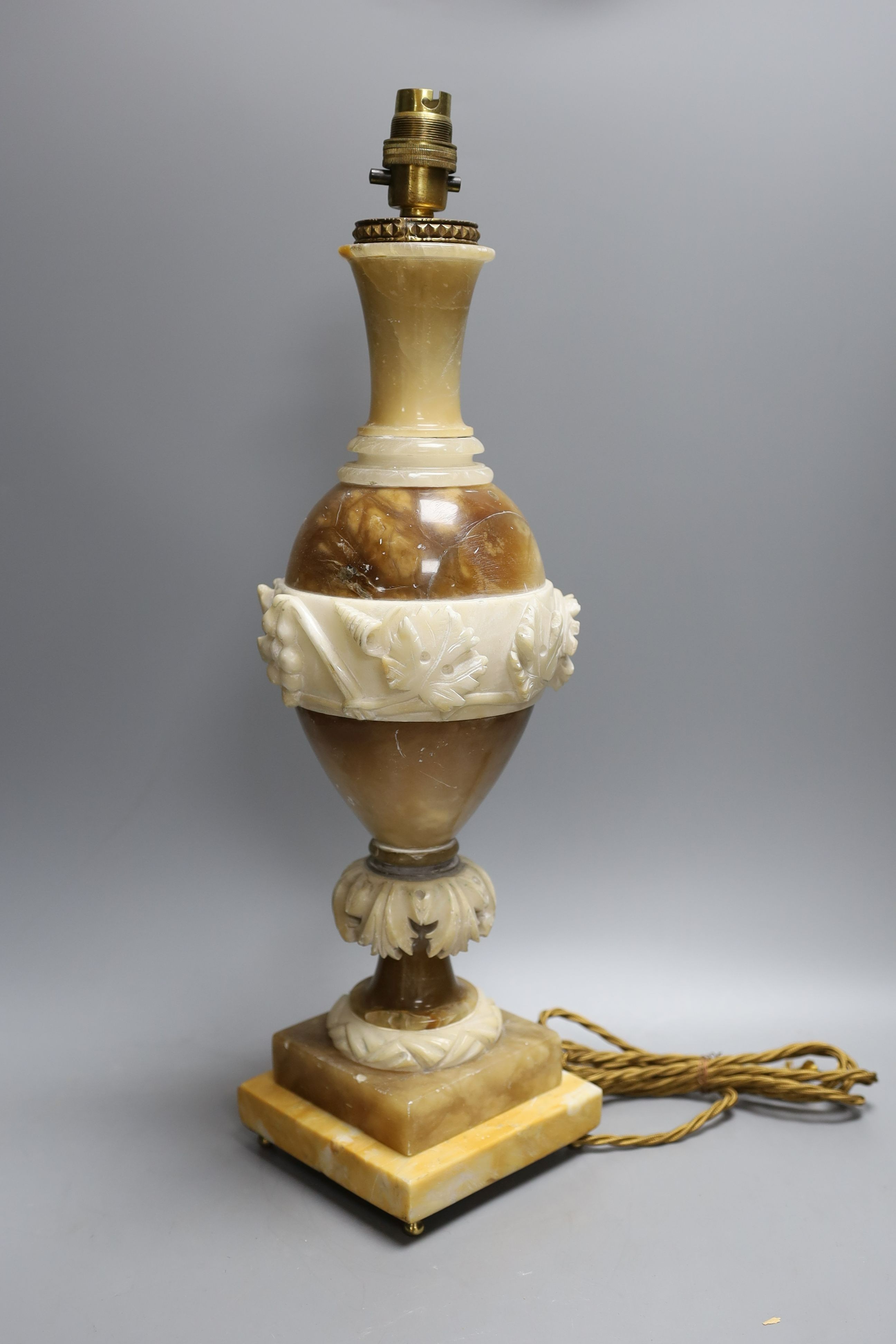 A carved alabaster table lamp